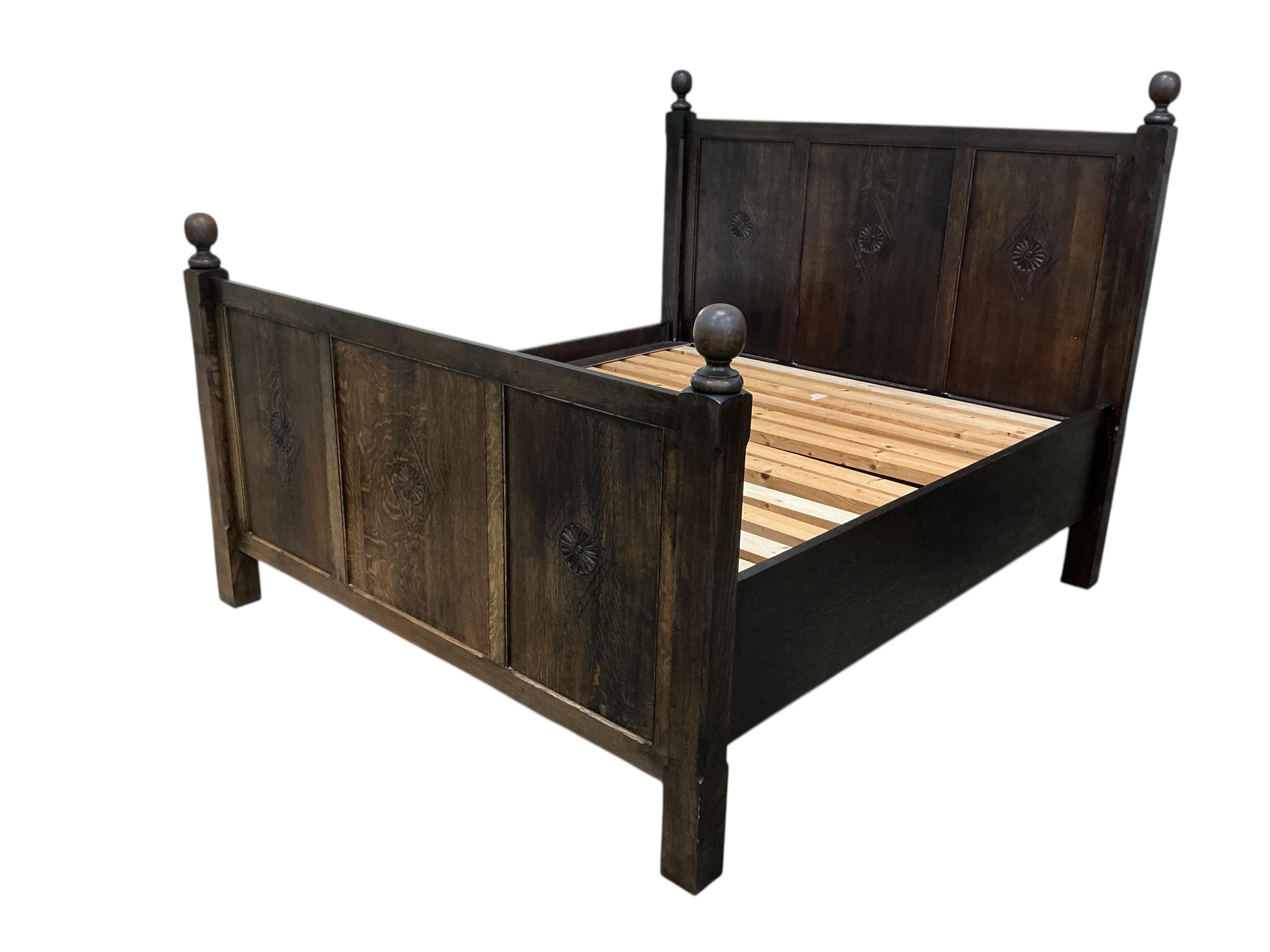 An 18th century style oak Superking double bed frame, width 190cm, length 216cm, height 168cm